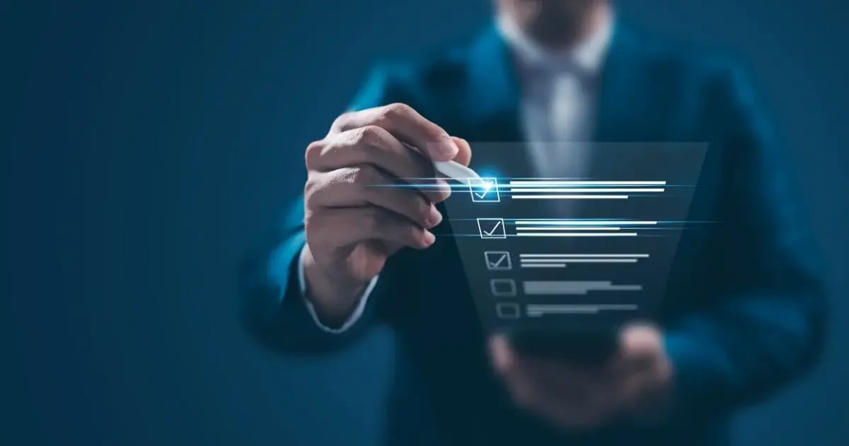 Business professional selecting a digital checklist on a transparent touchscreen interface.