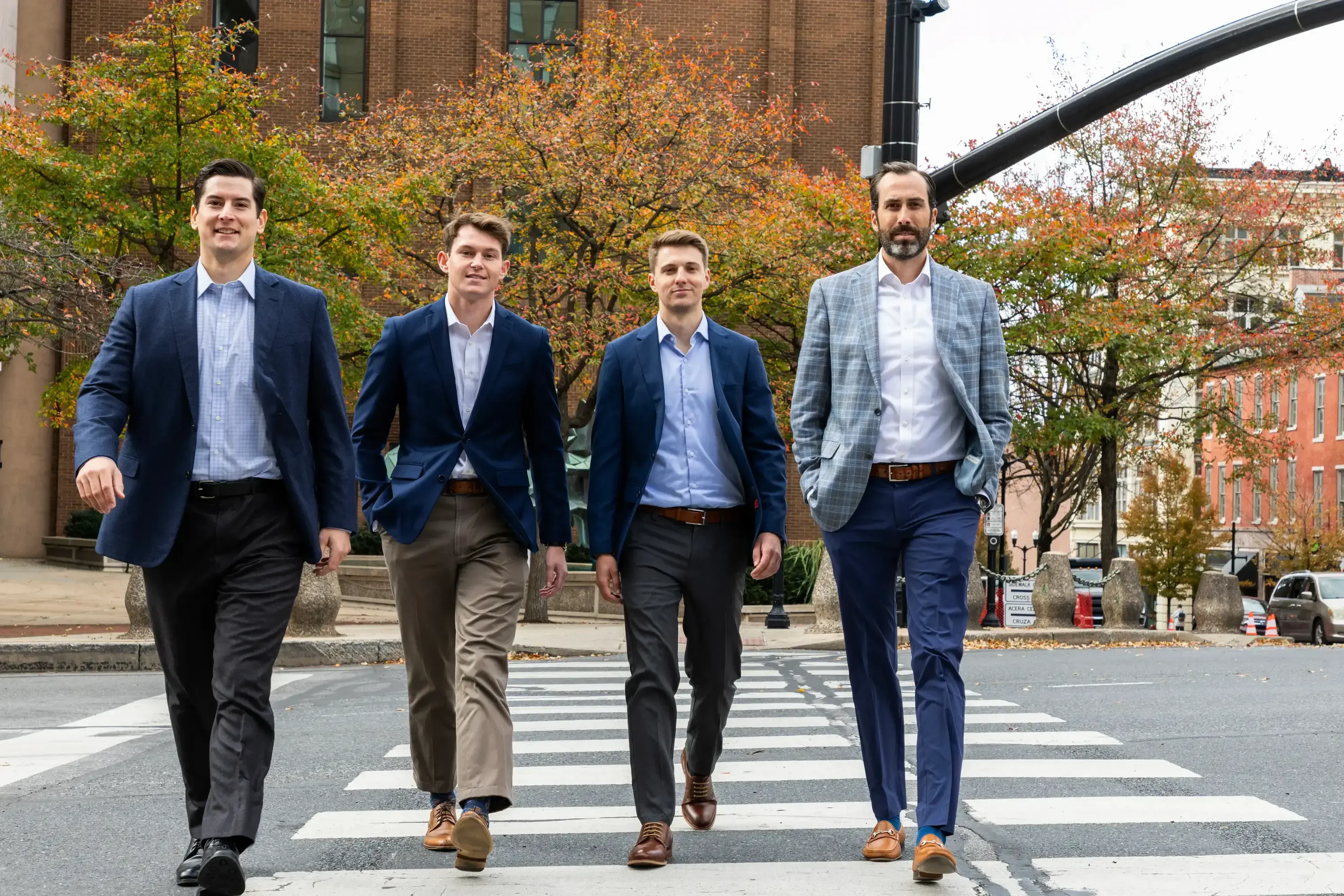 four Trout Capital Professionals walking in downtown Lancaster, PA 